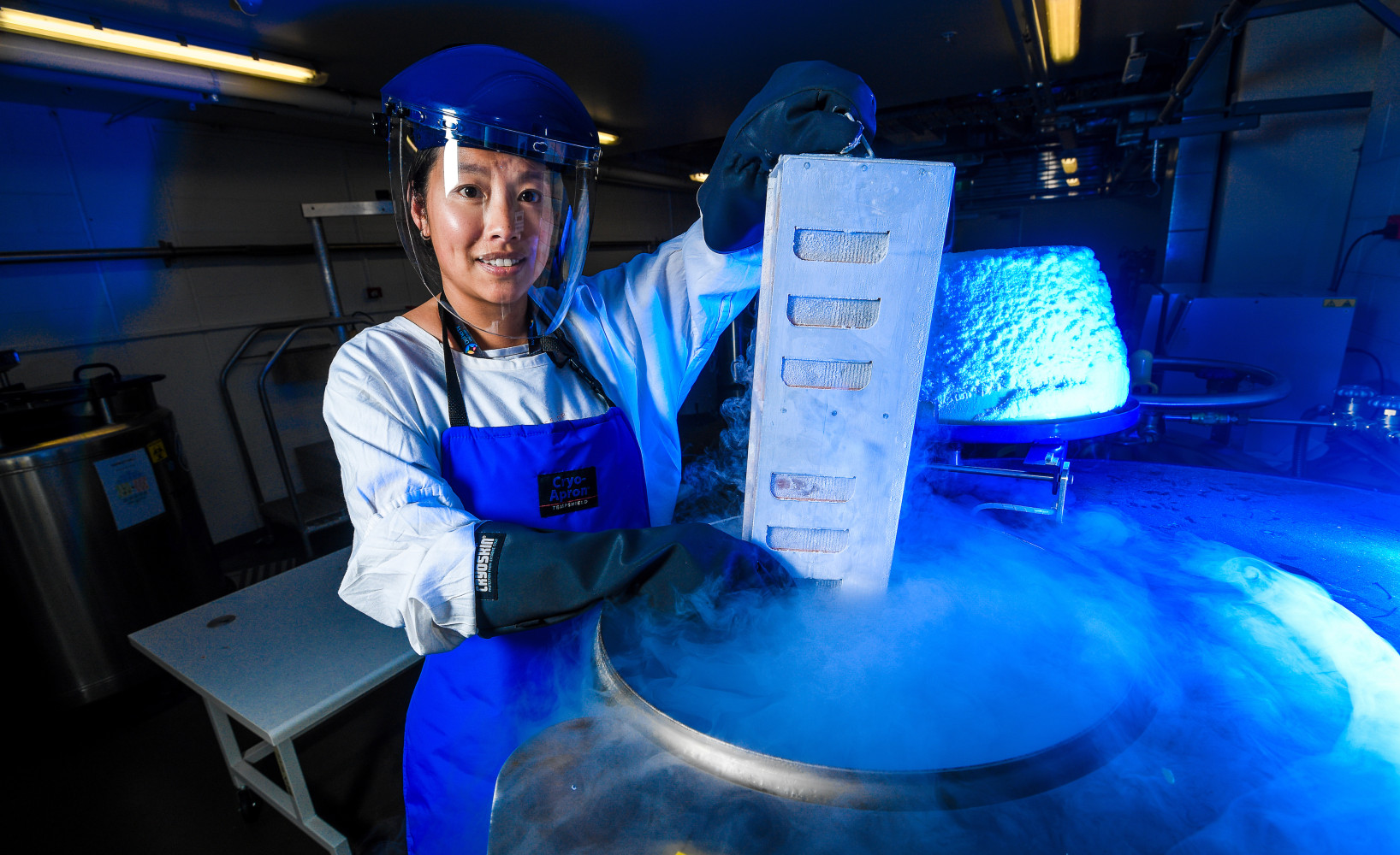 Dr Oanh Nguyen holding frozen samples